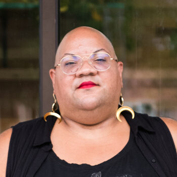 bald-woman-dangly-earrings