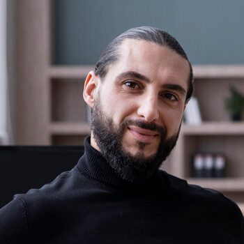 white-man-black-hair-and-black-turtle-neck